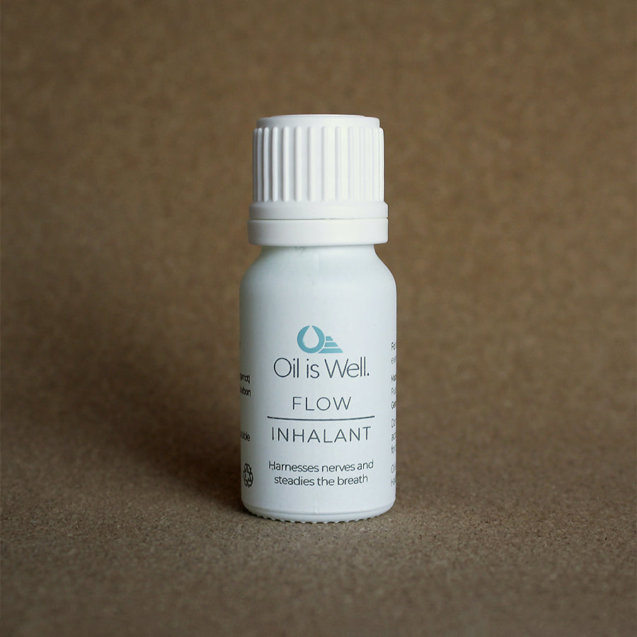 Oil Is Well Flow Inhalant, harnesses nerves and steadies the breath, in a compact white bottle.