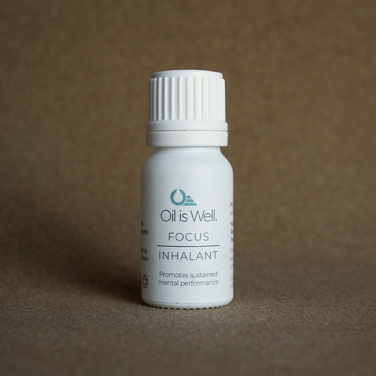 Oil Is Well Focus Inhalant, promotes mental performance, in a small white bottle for easy use.